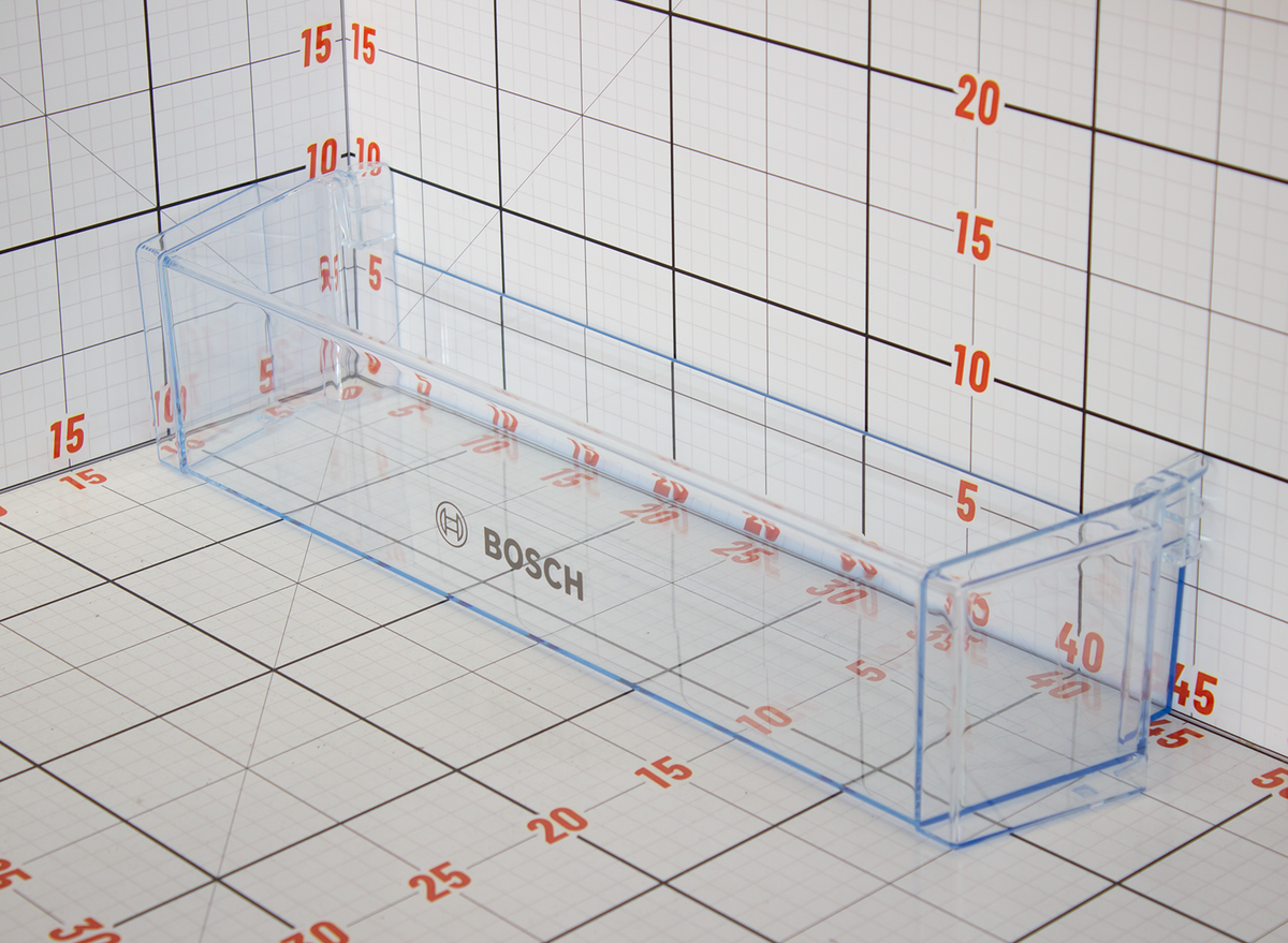 Clear plastic container with Bosch logo on a grid background