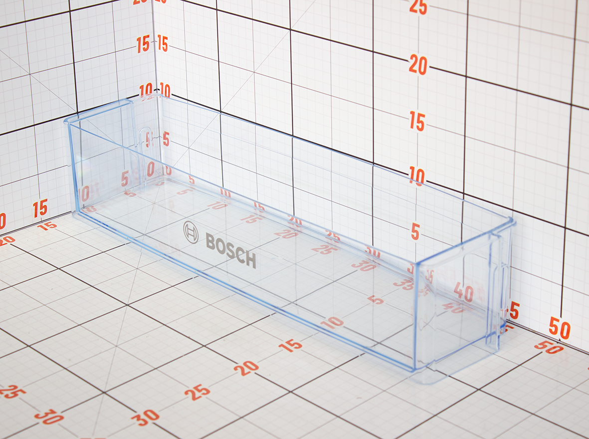 Clear plastic component with Bosch branding on a grid background