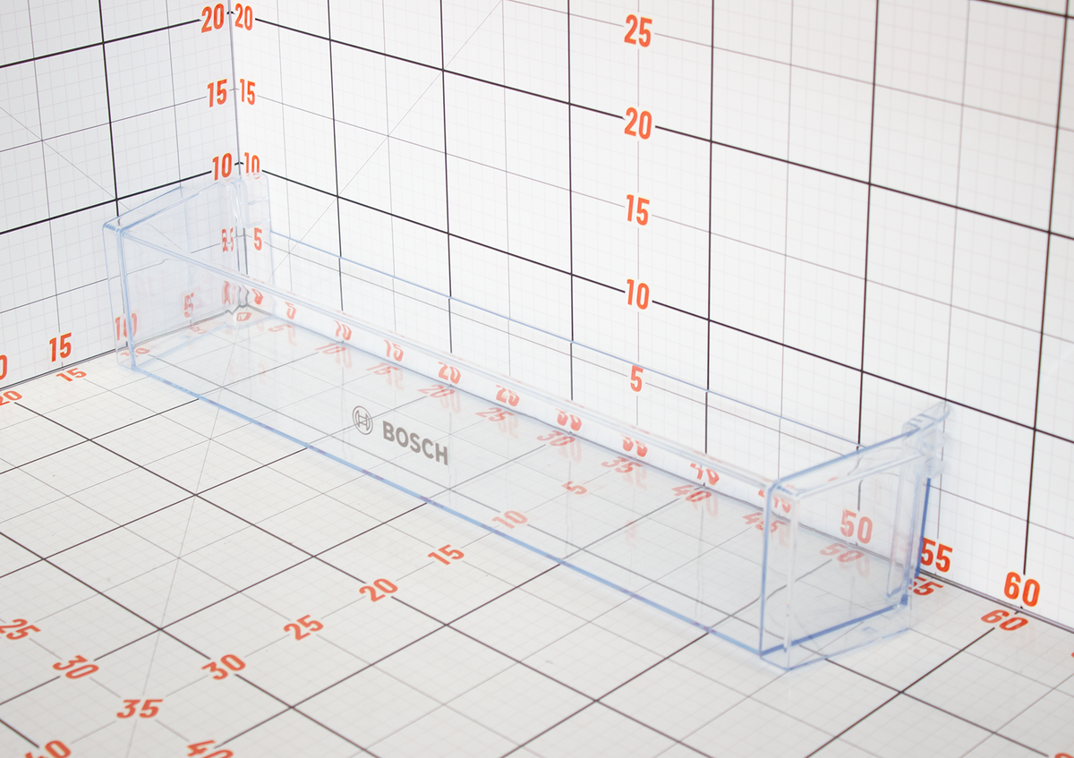 Clear plastic shelf with Bosch logo on a grid background