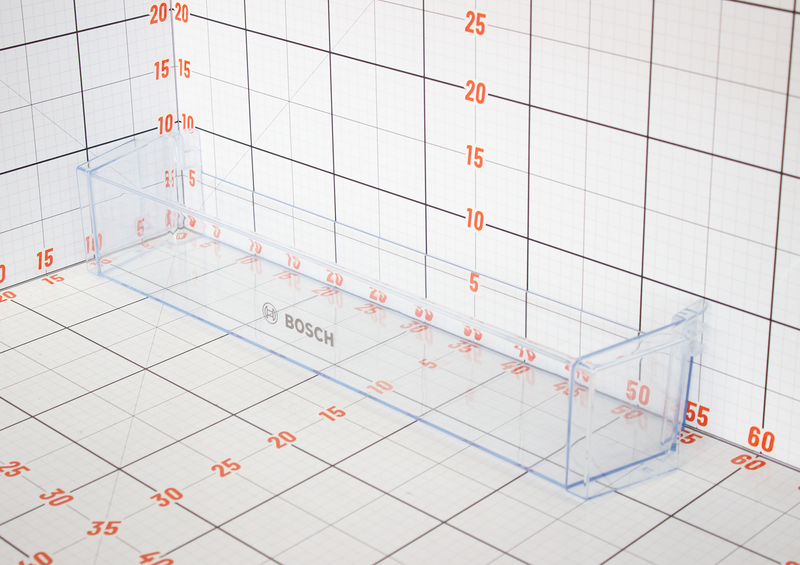 Clear plastic shelf with Bosch logo on a grid background