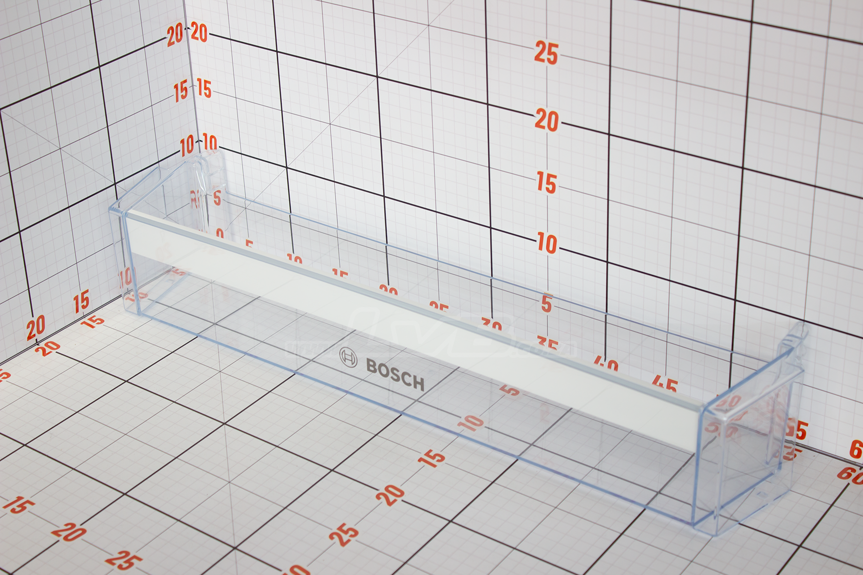 Clear plastic component with Bosch branding on a grid background